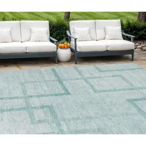 Photo of Teal Blue And Aqua Geometric Washable Indoor Outdoor Area Rug