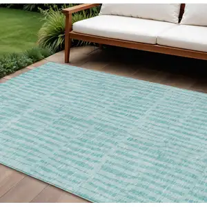 Photo of Teal Blue And Aqua Striped Washable Indoor Outdoor Area Rug