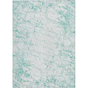 Photo of Teal Blue And Ivory Abstract Washable Indoor Outdoor Area Rug