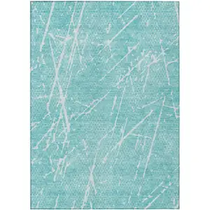 Photo of Teal Blue And Ivory Abstract Washable Indoor Outdoor Area Rug