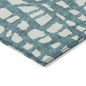 Photo of Teal Blue And Ivory Abstract Washable Indoor Outdoor Area Rug