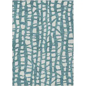 Photo of Teal Blue And Ivory Abstract Washable Indoor Outdoor Area Rug