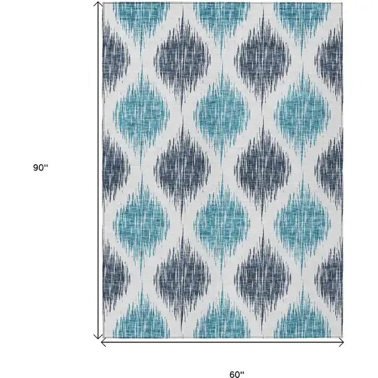 Teal Blue And Ivory Ikat Washable Indoor Outdoor Area Rug Photo 3