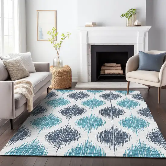 Teal Blue And Ivory Ikat Washable Indoor Outdoor Area Rug Photo 9