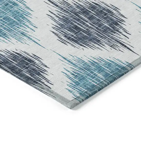 Teal Blue And Ivory Ikat Washable Indoor Outdoor Area Rug Photo 4