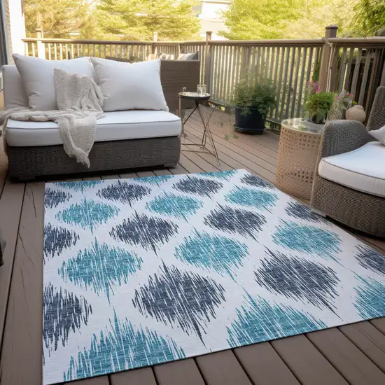 Teal Blue And Ivory Ikat Washable Indoor Outdoor Area Rug Photo 8