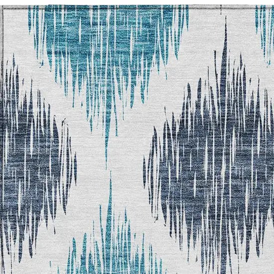 Teal Blue And Ivory Ikat Washable Indoor Outdoor Area Rug Photo 7