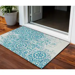 Photo of Teal Blue And Ivory Medallion Washable Indoor Outdoor Area Rug