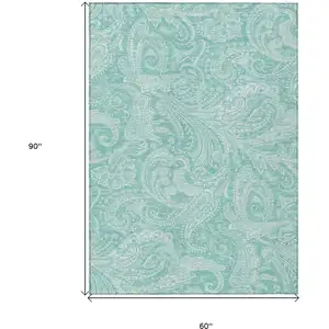 Photo of Teal Blue And Ivory Paisley Washable Indoor Outdoor Area Rug