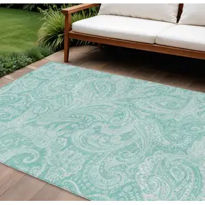 Photo of Teal Blue And Ivory Paisley Washable Indoor Outdoor Area Rug