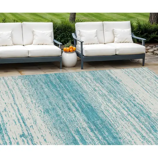 Teal Blue And Ivory Striped Washable Indoor Outdoor Area Rug Photo 1