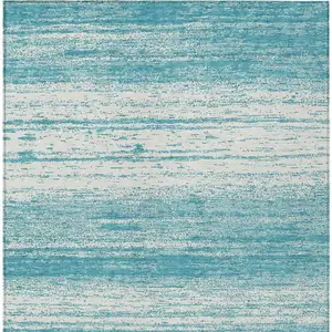 Photo of Teal Blue And Ivory Striped Washable Indoor Outdoor Area Rug