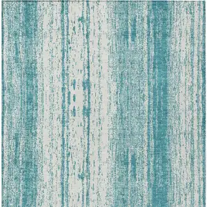 Photo of Teal Blue And Ivory Striped Washable Indoor Outdoor Area Rug