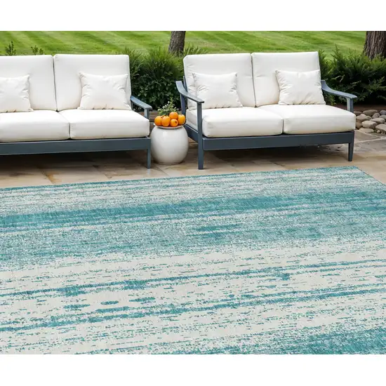 Teal Blue And Ivory Striped Washable Indoor Outdoor Area Rug Photo 1