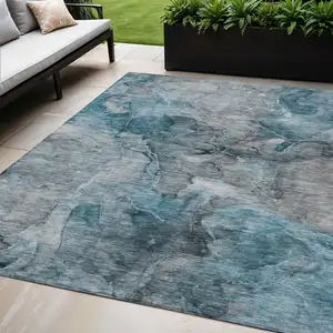 Photo of Teal Blue And Navy Blue Abstract Washable Indoor Outdoor Area Rug