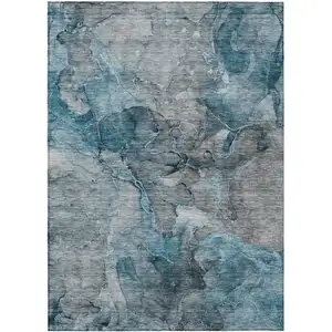 Photo of Teal Blue And Navy Blue Abstract Washable Indoor Outdoor Area Rug