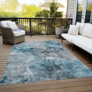 Photo of Teal Blue And Navy Blue Abstract Washable Indoor Outdoor Area Rug