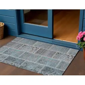 Photo of Teal Blue Aqua And Beige Patchwork Washable Indoor Outdoor Area Rug