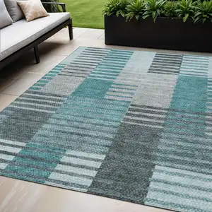 Photo of Teal Blue Aqua And Gray Striped Washable Indoor Outdoor Area Rug