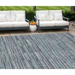 Photo of Teal Blue Aqua And Gray Striped Washable Indoor Outdoor Area Rug