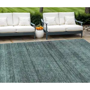 Photo of Teal Blue Aqua And Gray Striped Washable Indoor Outdoor Area Rug