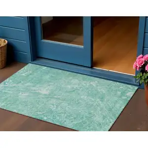 Photo of Teal Blue Aqua And Green Abstract Washable Indoor Outdoor Area Rug