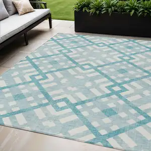 Photo of Teal Blue Aqua And Ivory Geometric Washable Indoor Outdoor Area Rug