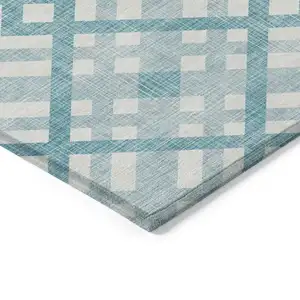 Photo of Teal Blue Aqua And Ivory Geometric Washable Indoor Outdoor Area Rug