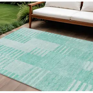 Photo of Teal Blue Aqua And Ivory Striped Washable Indoor Outdoor Area Rug