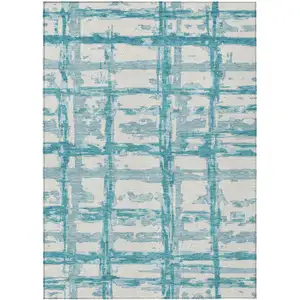 Photo of Teal Blue Aqua And Ivory Striped Washable Indoor Outdoor Area Rug