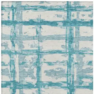 Photo of Teal Blue Aqua And Ivory Striped Washable Indoor Outdoor Area Rug