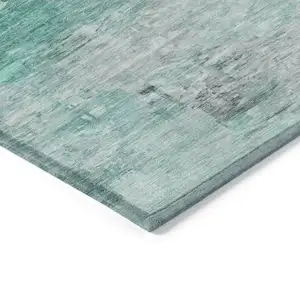 Photo of Teal Blue Aqua And Silver Abstract Washable Indoor Outdoor Area Rug