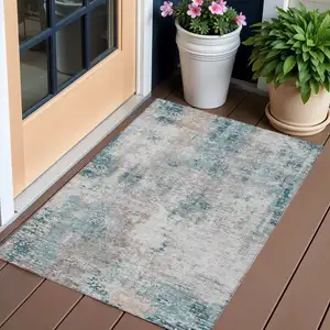 Photo of Teal Blue Beige And Copper Abstract Washable Indoor Outdoor Area Rug