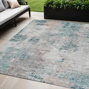 Photo of Teal Blue Beige And Copper Abstract Washable Indoor Outdoor Area Rug