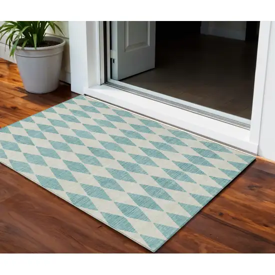 Teal Blue And Ivory Geometric Washable Indoor Outdoor Area Rug Photo 1