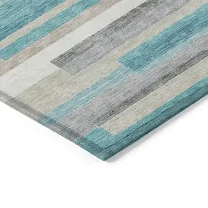 Photo of Teal Blue Gray And Beige Striped Washable Indoor Outdoor Area Rug