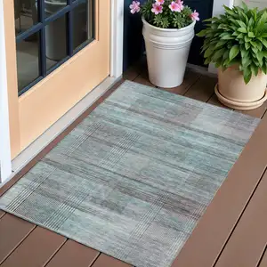 Photo of Teal Blue Gray And Charcoal Striped Washable Indoor Outdoor Area Rug