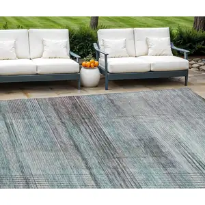 Photo of Teal Blue Gray And Charcoal Striped Washable Indoor Outdoor Area Rug