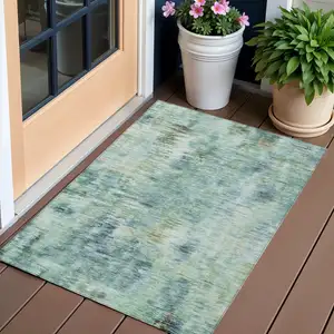 Photo of Teal Blue Green And Ivory Abstract Washable Indoor Outdoor Area Rug