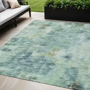 Photo of Teal Blue Green And Ivory Abstract Washable Indoor Outdoor Area Rug