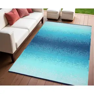 Photo of Teal Blue Machine Braided Distressed Area Rug With UV Protection