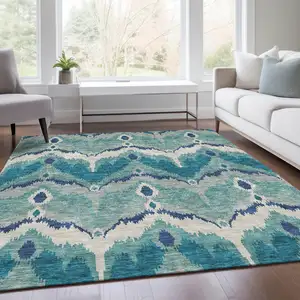 Photo of Teal Blue Navy Blue And Ivory Ikat Washable Indoor Outdoor Area Rug