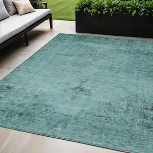 Photo of Teal Blue Turquoise And Charcoal Oriental Washable Indoor Outdoor Area Rug