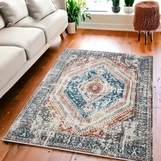 Teal Taupe and Rust Geometric Distressed Area Rug With Fringe Photo 1