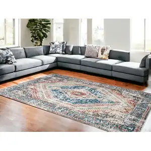 Photo of Teal Taupe and Rust Geometric Distressed Area Rug With Fringe