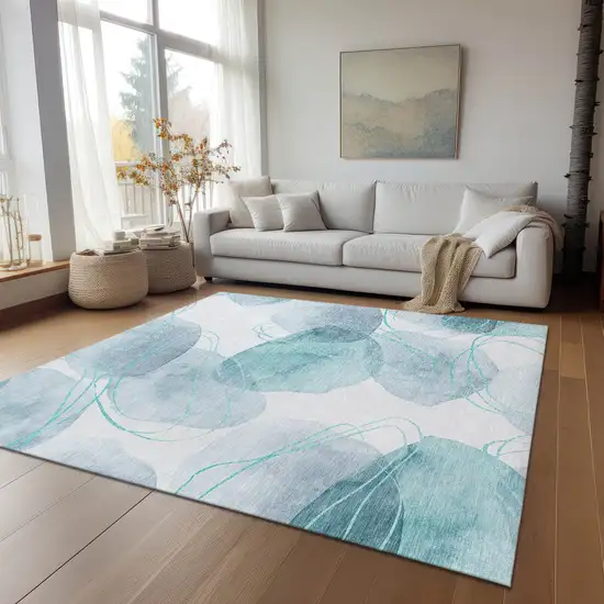 Teal and Ivory Abstract Washable Non Skid Indoor Outdoor Area Rug Photo 9