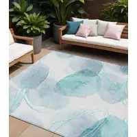 Photo of Teal and Ivory Abstract Washable Non Skid Indoor Outdoor Area Rug