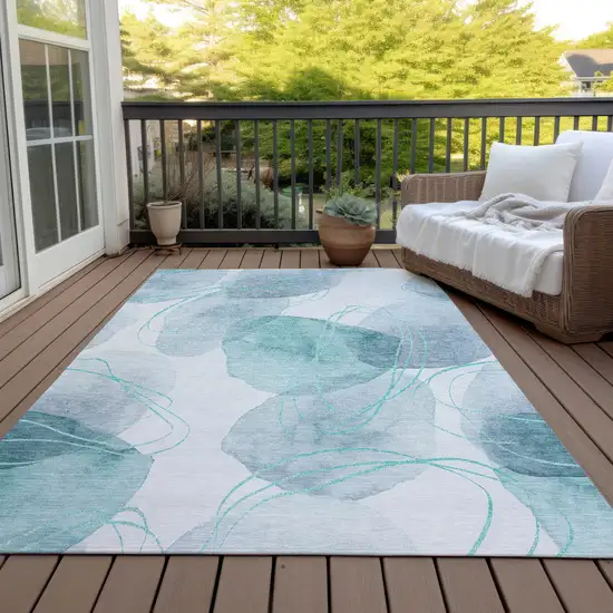 Teal and Ivory Abstract Washable Non Skid Indoor Outdoor Area Rug Photo 7