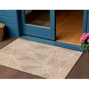 Photo of Terra Cotta Beige And Salmon Geometric Washable Indoor Outdoor Area Rug