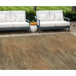 Photo of Terra Cotta Brown And Copper Abstract Washable Indoor Outdoor Area Rug